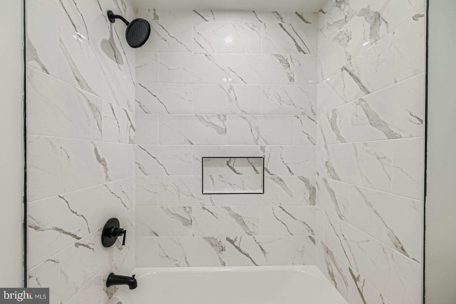 1729 North Fulton Avenue Baltimore, MD 21217 - Photo 17 of 30 a bathroom with a bathtub