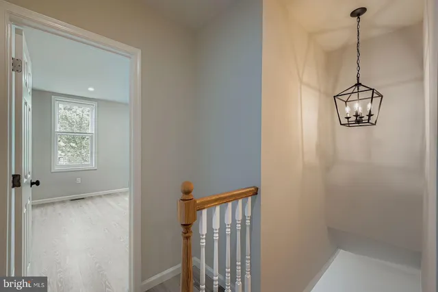 a view of a hallway with a window