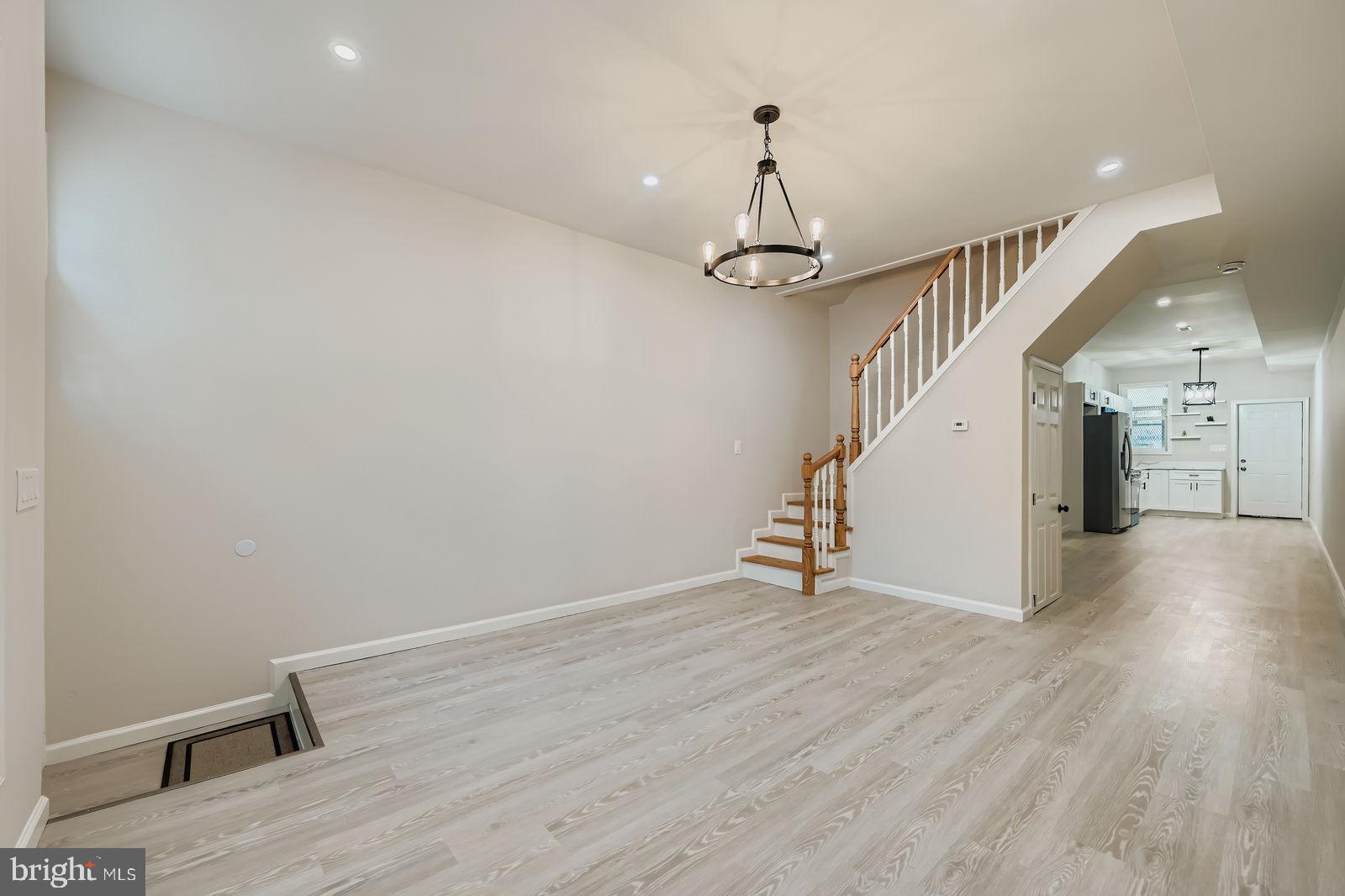 1729 North Fulton Avenue Baltimore, MD 21217 - Photo 3 of 30 a view of empty room with wooden floor