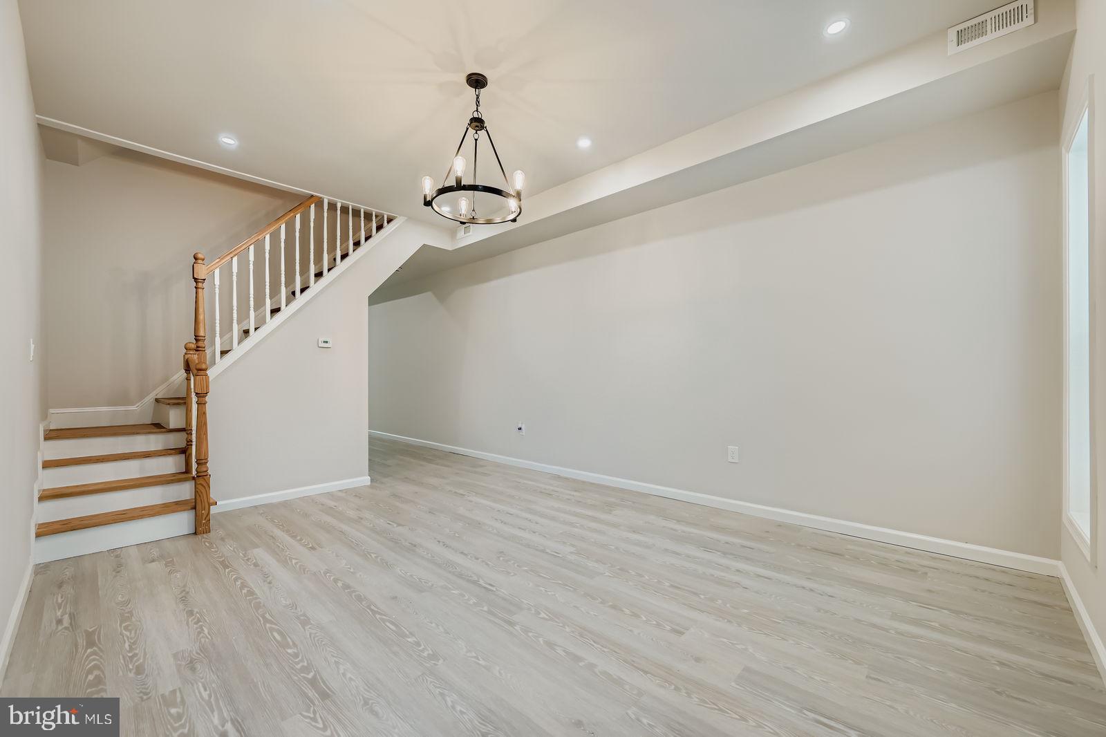 1729 North Fulton Avenue Baltimore, MD 21217 - Photo 5 of 30 a view of entryway and hall with wooden floor