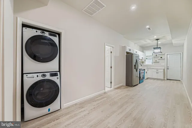 a view of a storage & utility room with washer and dryer
