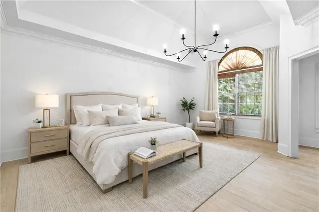 a view of empty room with wooden floor and window