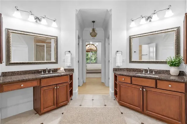 a spacious bathroom with a granite countertop tub sink and a mirror