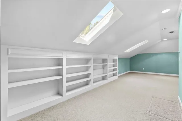 a view of a house with a snow on the road