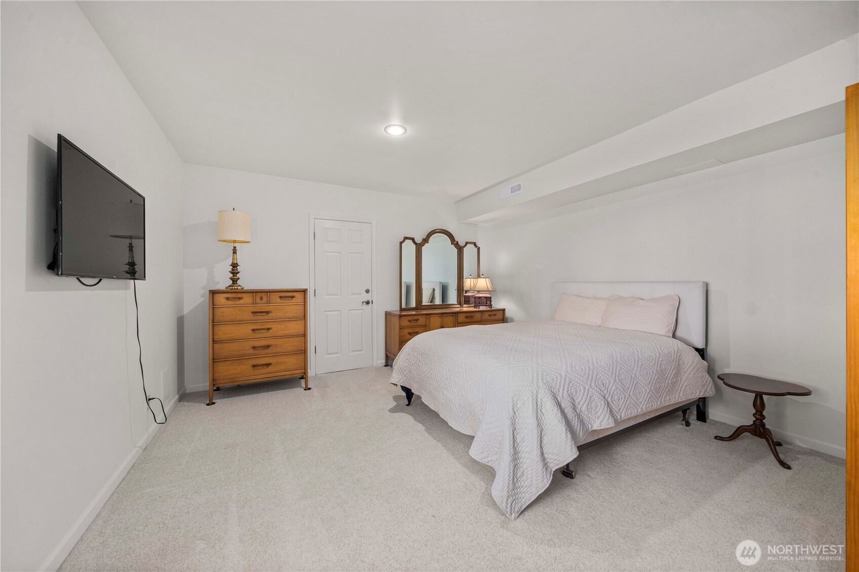 491 Bachelor Road Sequim, WA 98382 - Photo 26 of 39 a bedroom with a bed and a flat screen television