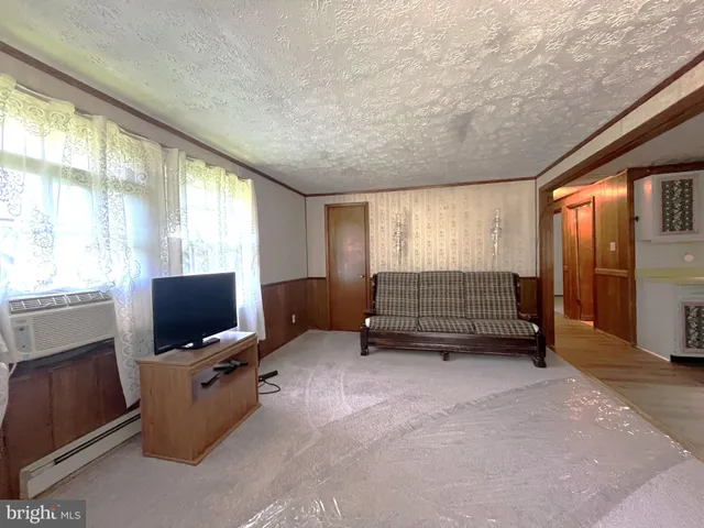 a room with furniture and flat screen tv