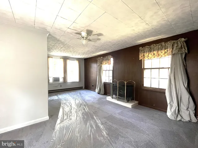 a view of workspace with furniture and window