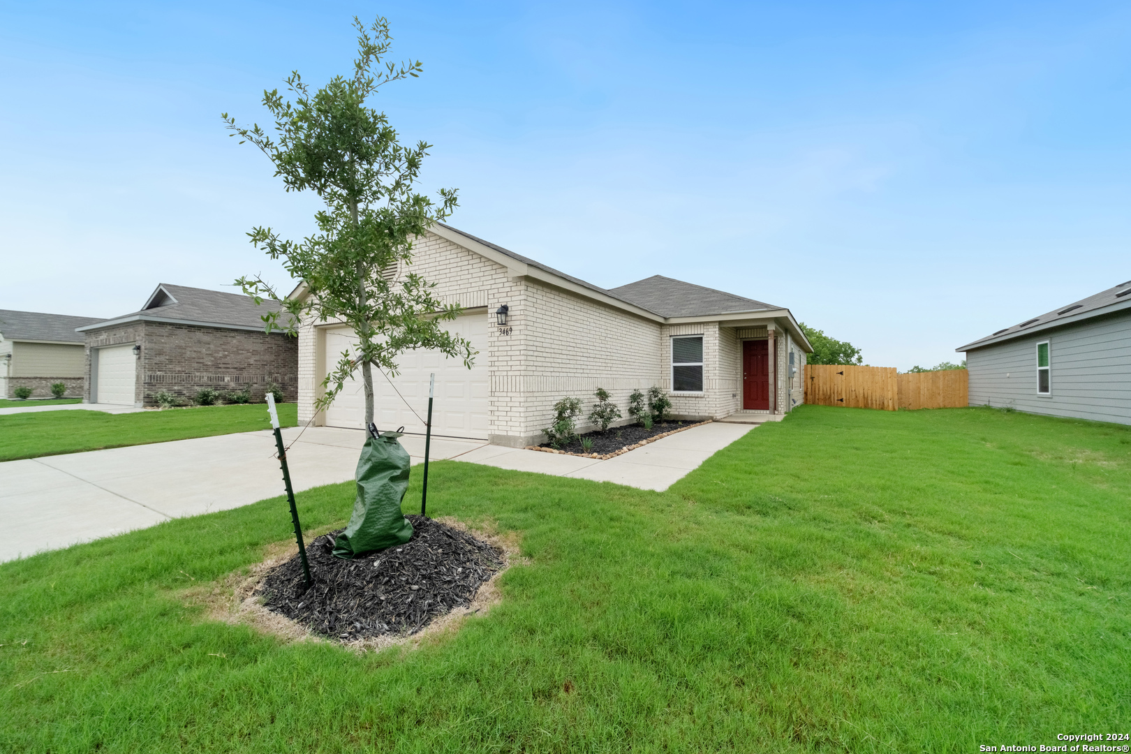 3469 Canyon Ridge Seguin, TX 78155 - Photo 1 of 1 a view of a house with a yard and a garden