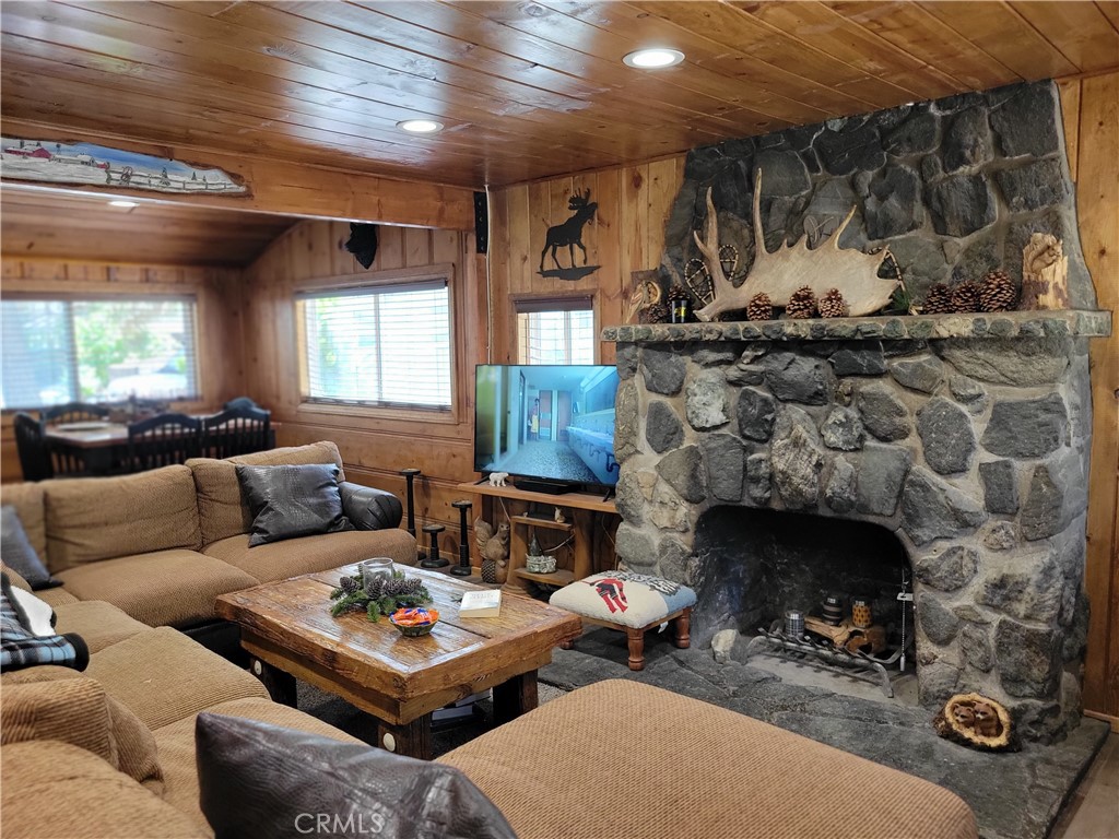1116 Lark Road Wrightwood, CA 92397 - Photo 20 of 46 a living room with furniture and a fireplace
