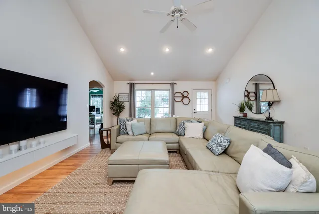 a large kitchen with stainless steel appliances granite countertop a stove a sink and a microwave