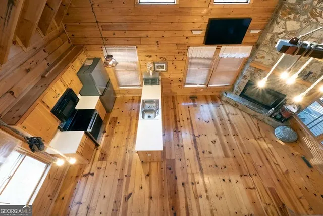 a view of an entryway with wooden floor