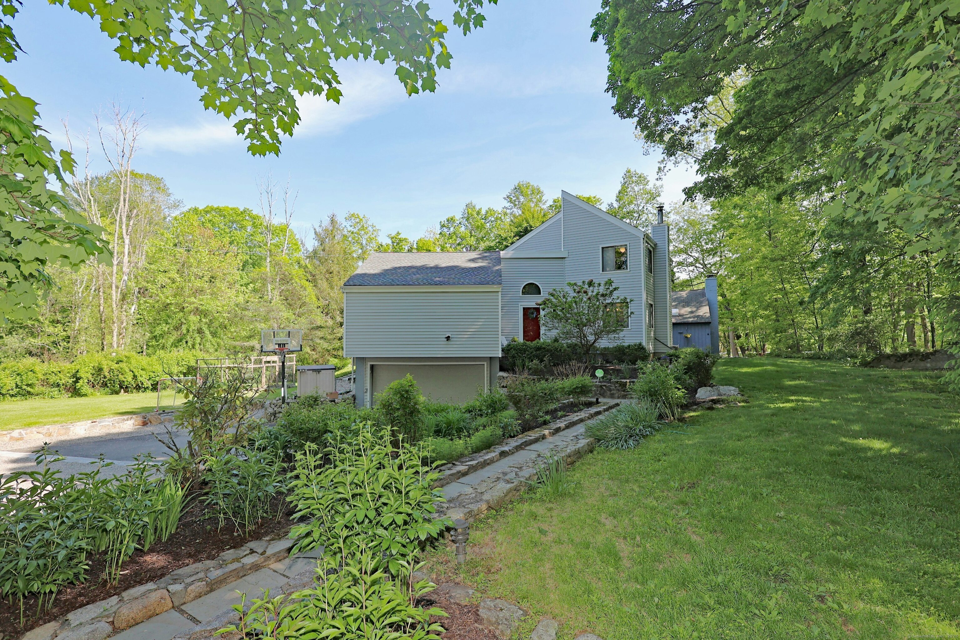 a house view with a garden space