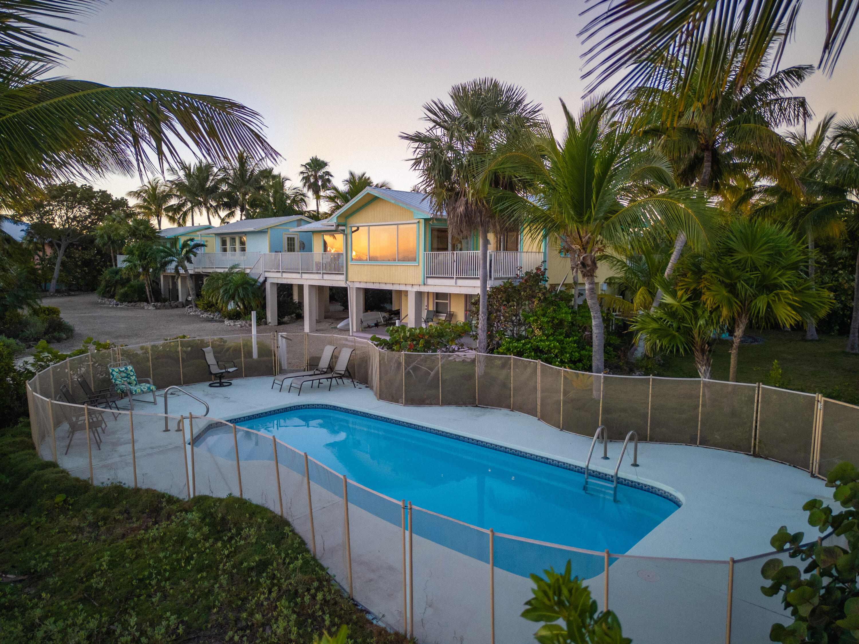 17385 Keystone Road Sugarloaf, FL 33042 - Photo 11 of 74 a view of swimming pool with lawn chairs and plants
