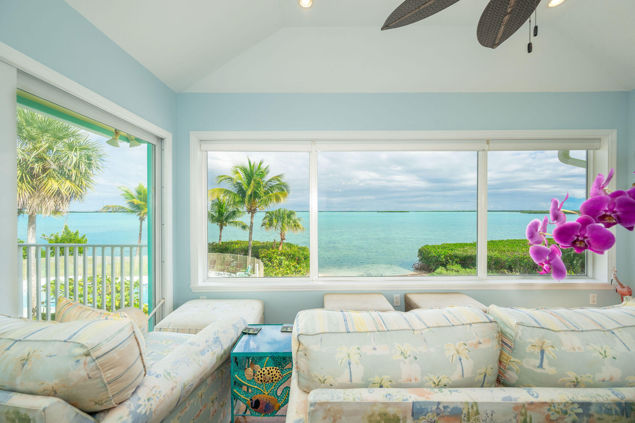 17385 Keystone Road Sugarloaf, FL 33042 - Photo 55 of 74 a living room with furniture and a floor to ceiling window