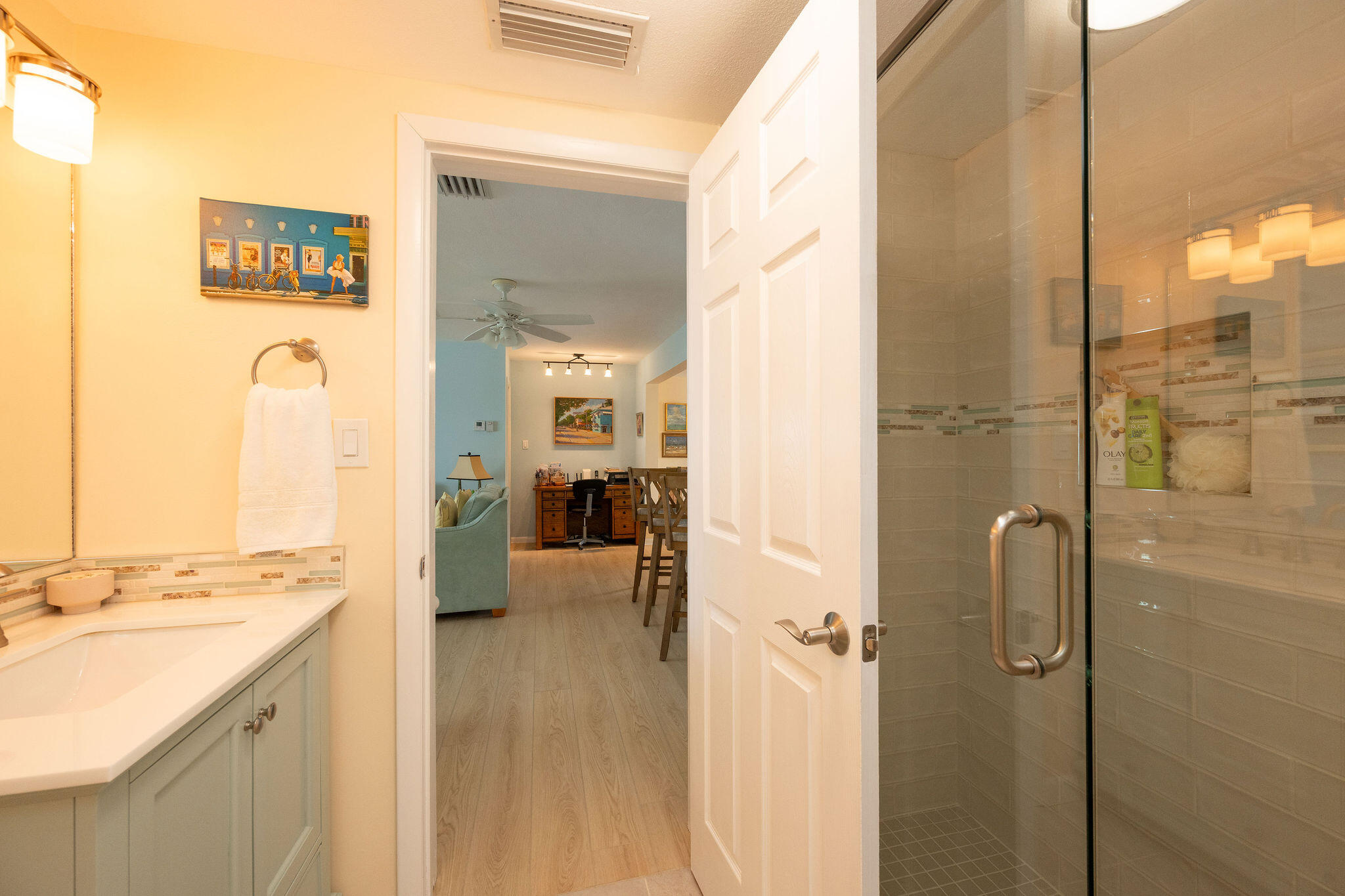 17385 Keystone Road Sugarloaf, FL 33042 - Photo 59 of 74 a bathroom with a double vanity sink a mirror and a shower