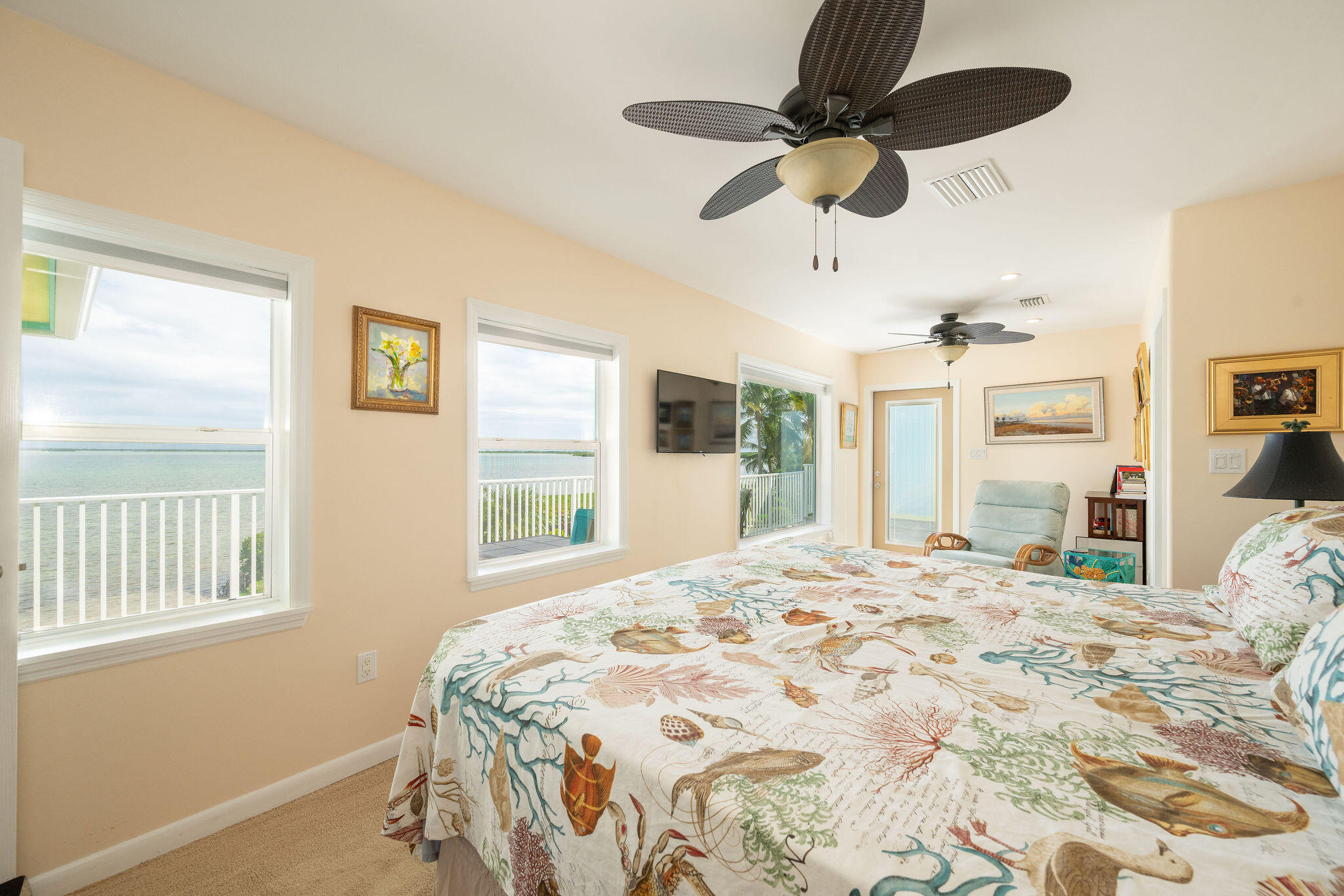 17385 Keystone Road Sugarloaf, FL 33042 - Photo 61 of 74 a bedroom with a bed ceiling fan and a large window