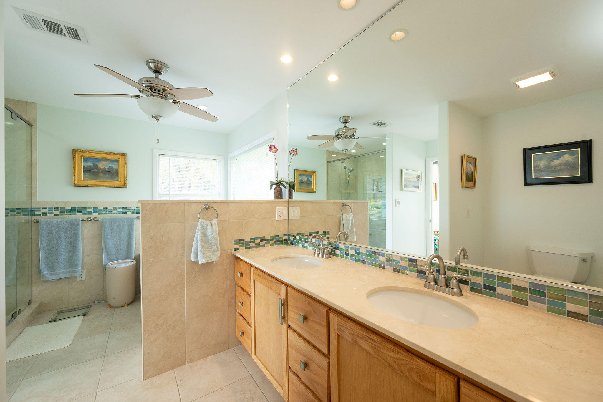 17385 Keystone Road Sugarloaf, FL 33042 - Photo 66 of 74 a bathroom with a double vanity sink a mirror and a bathtub
