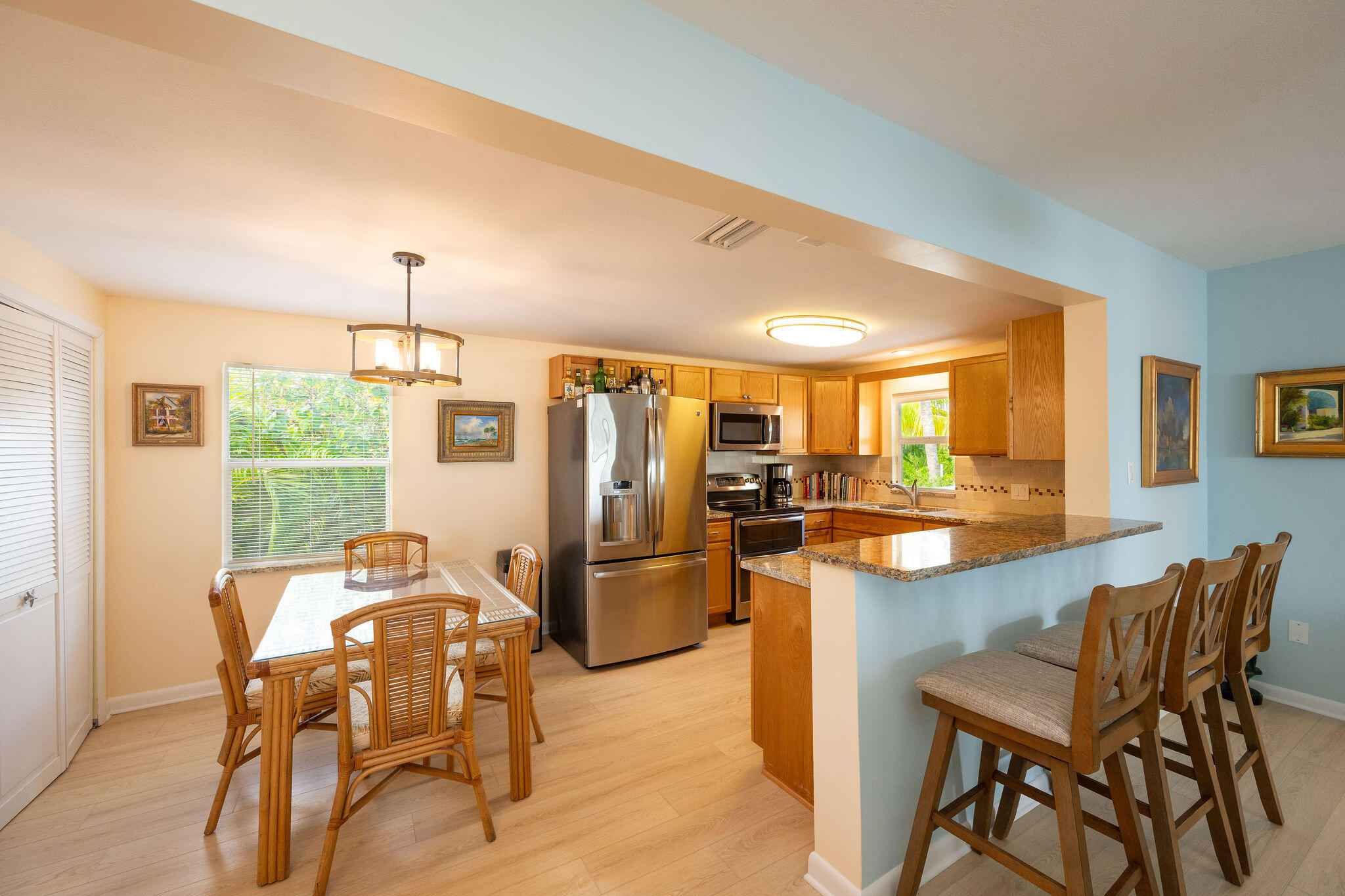 17385 Keystone Road Sugarloaf, FL 33042 - Photo 68 of 74 a kitchen with stainless steel appliances kitchen island granite countertop furniture and a refrigerator