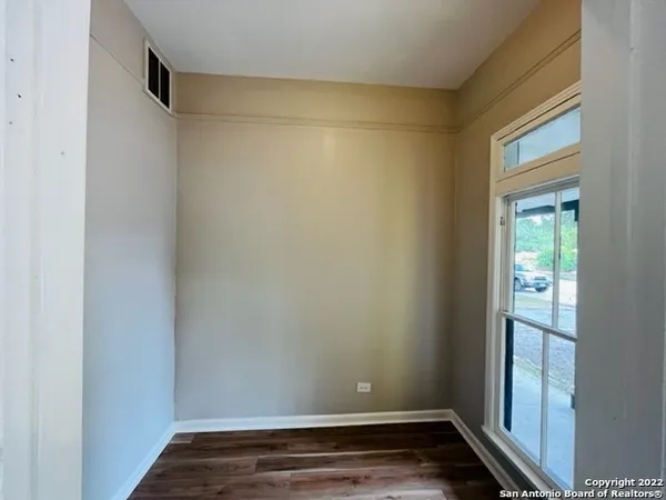 a view of small space with wooden floor