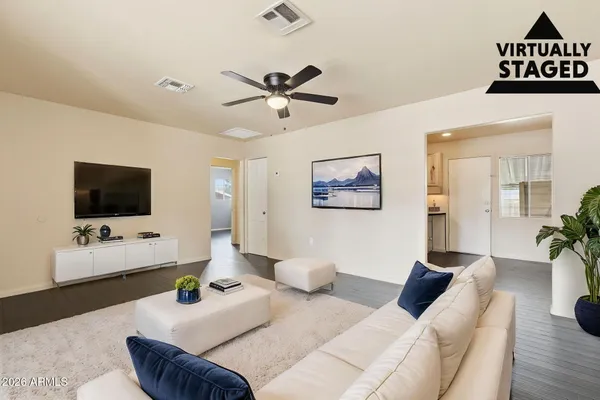 a living room with furniture and a flat screen tv