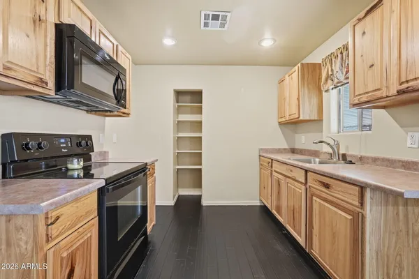 a kitchen with stainless steel appliances granite countertop a stove and a sink