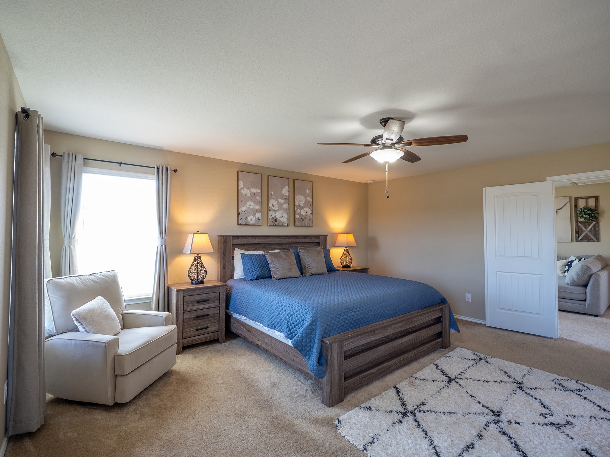 104 Rocroi Drive Georgetown, TX 78626 - Photo 14 of 40 Soft carpeting pairs with neutral walls and a large window in this peaceful sleeping space.