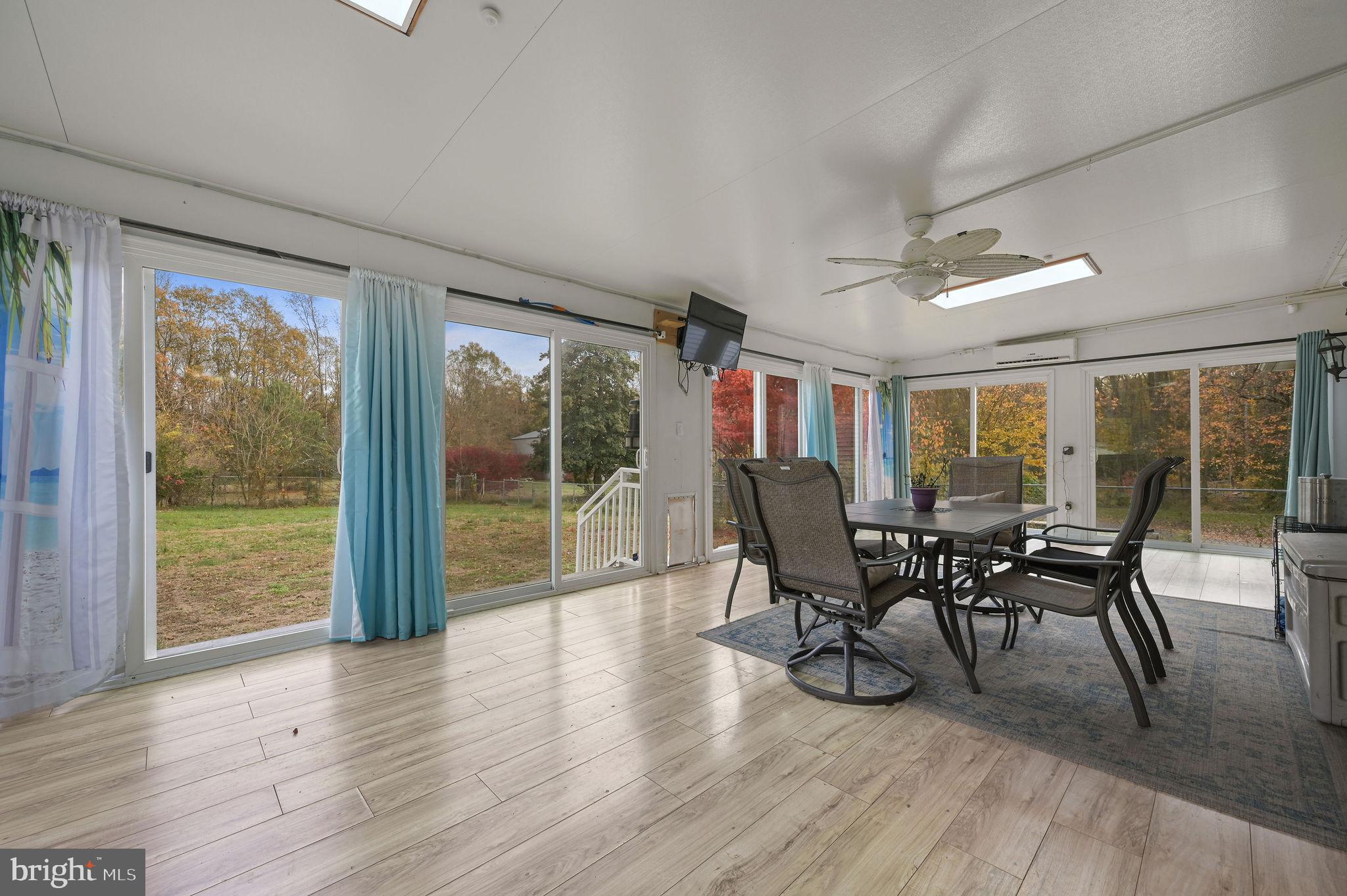 850 Arthursville Road Hartly, DE 19953 - Photo 16 of 35 a dining room with furniture window and wooden floor