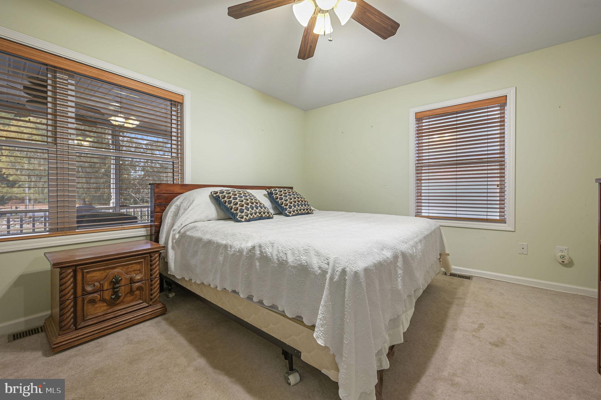 850 Arthursville Road Hartly, DE 19953 - Photo 20 of 35 a bedroom with a bed and a chandelier