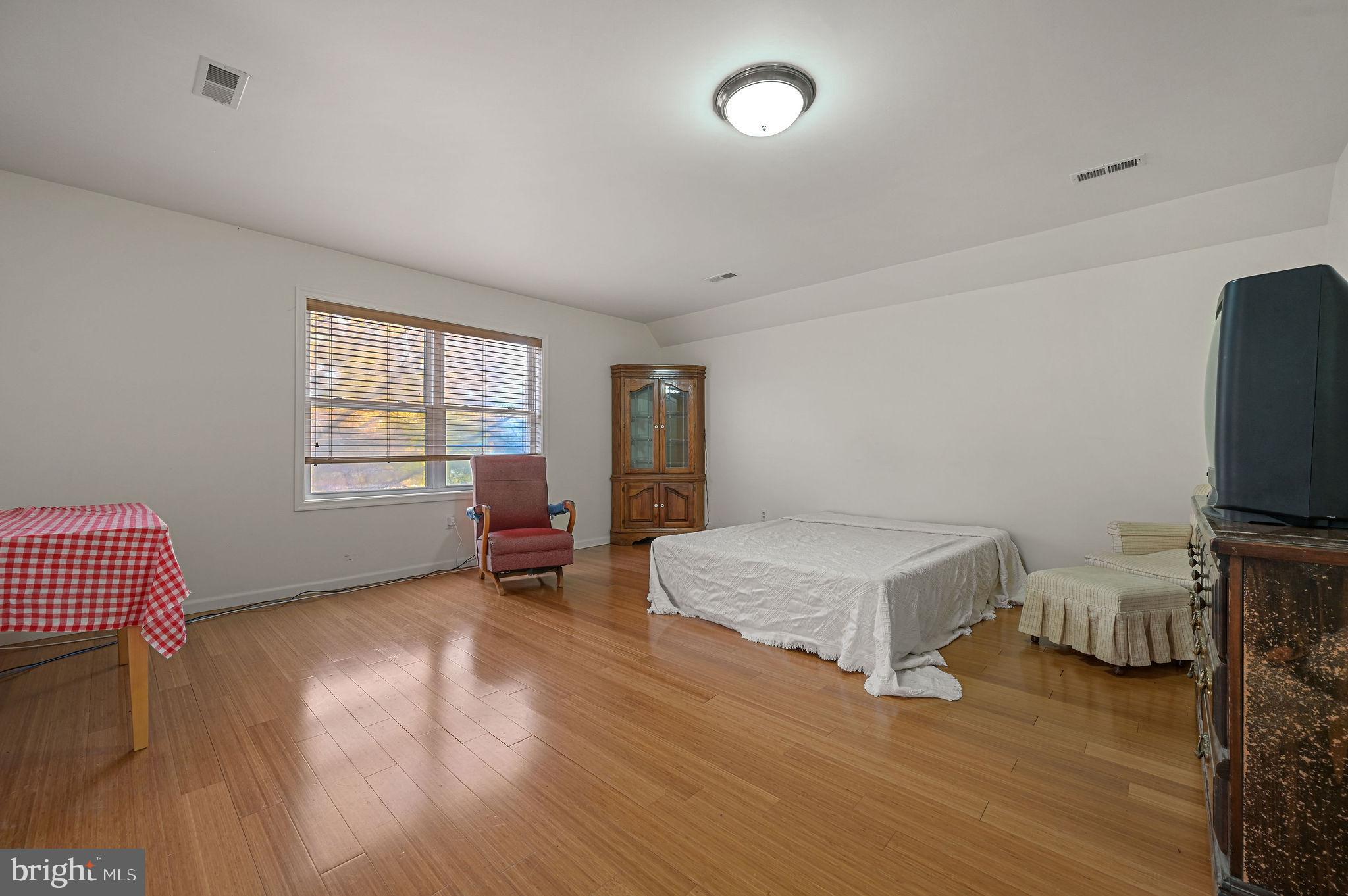850 Arthursville Road Hartly, DE 19953 - Photo 25 of 35 a living room with furniture and a flat screen tv