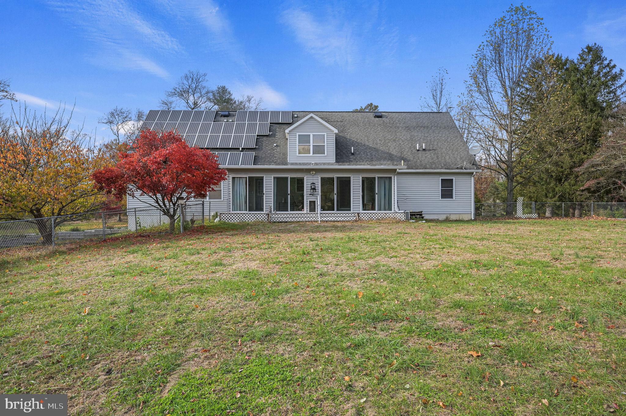 850 Arthursville Road Hartly, DE 19953 - Photo 3 of 35 a view of a house with a garden and trees