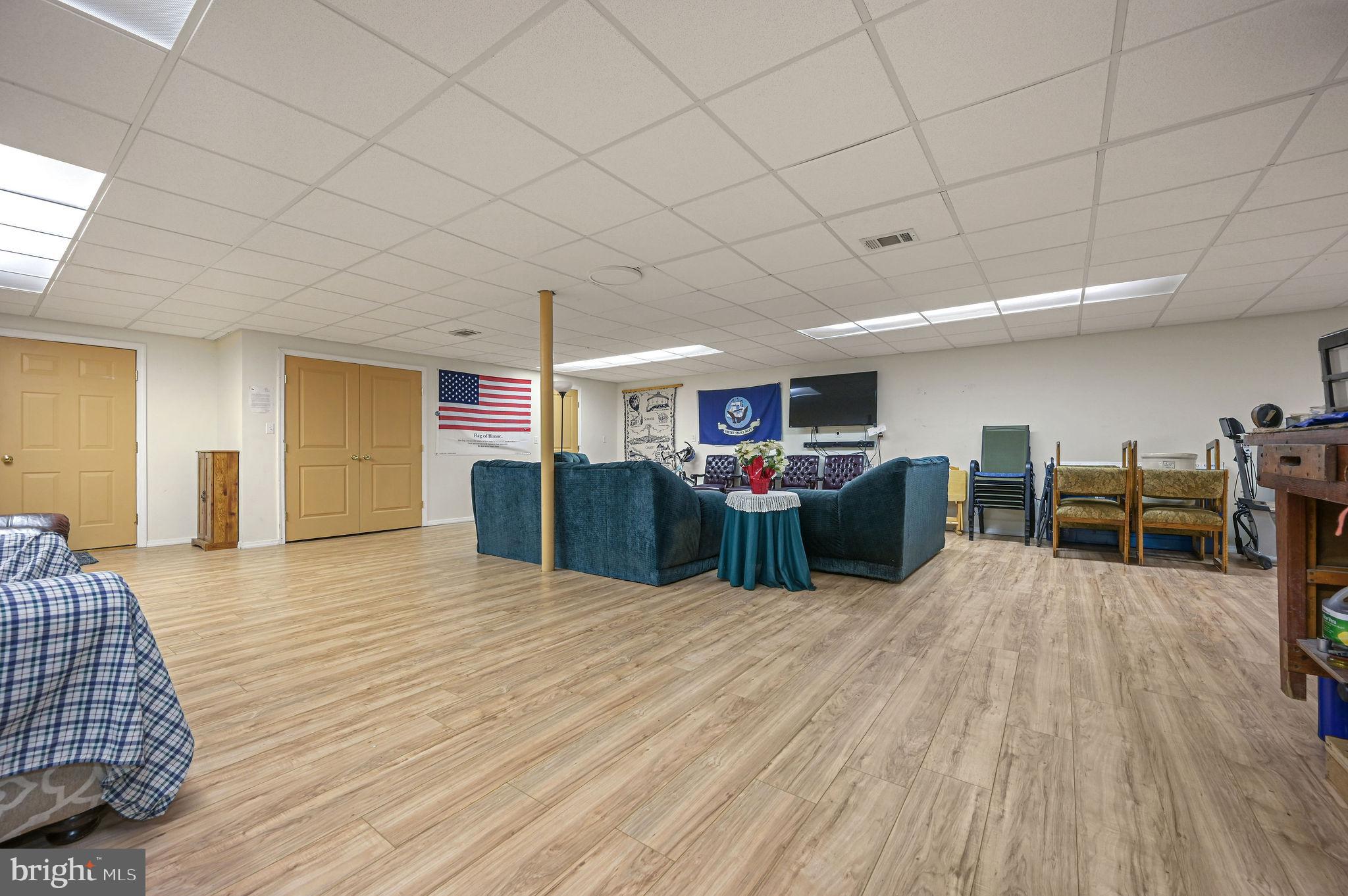 850 Arthursville Road Hartly, DE 19953 - Photo 33 of 35 a room with furniture and a wooden floor