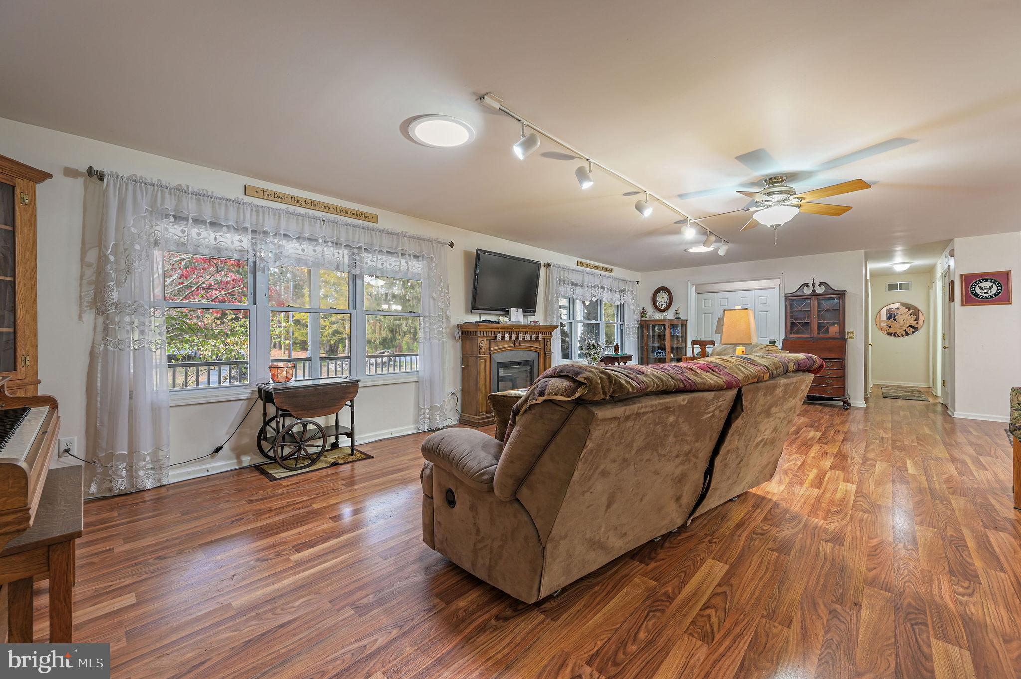 850 Arthursville Road Hartly, DE 19953 - Photo 9 of 35 a living room with furniture and a wooden floor