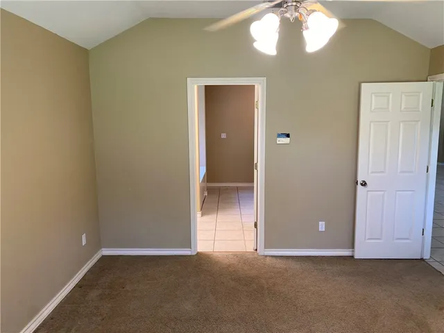 an empty room with closet area