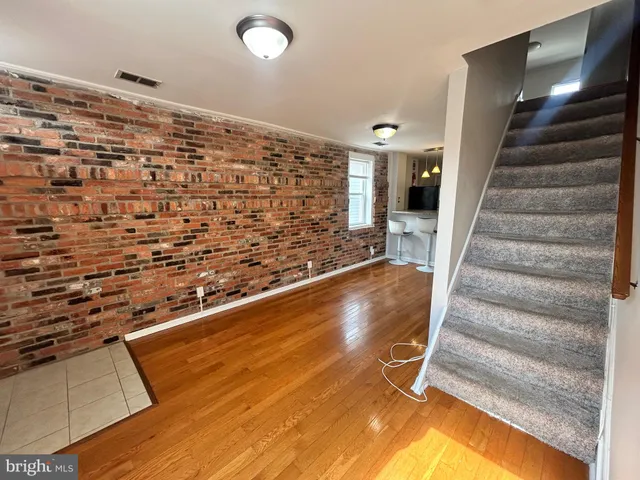 a view of entryway with wooden floor
