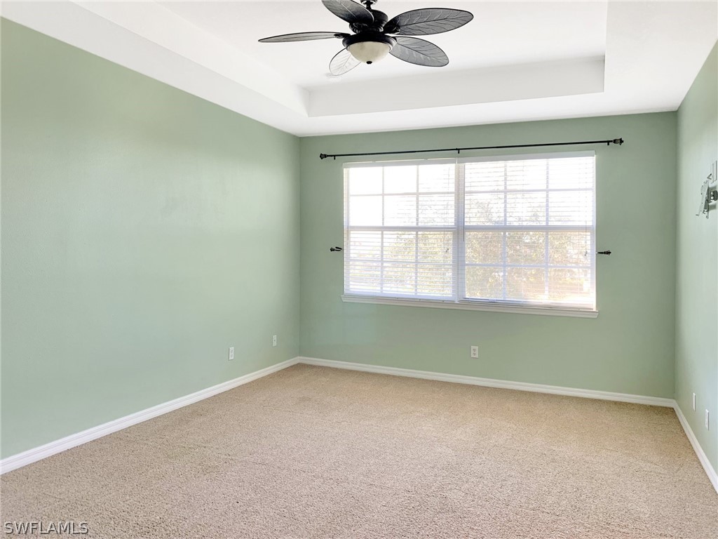 4100 Cherrybrook Loop Fort Myers, FL 33966 - Photo 13 of 25 an empty room with a window and a fan