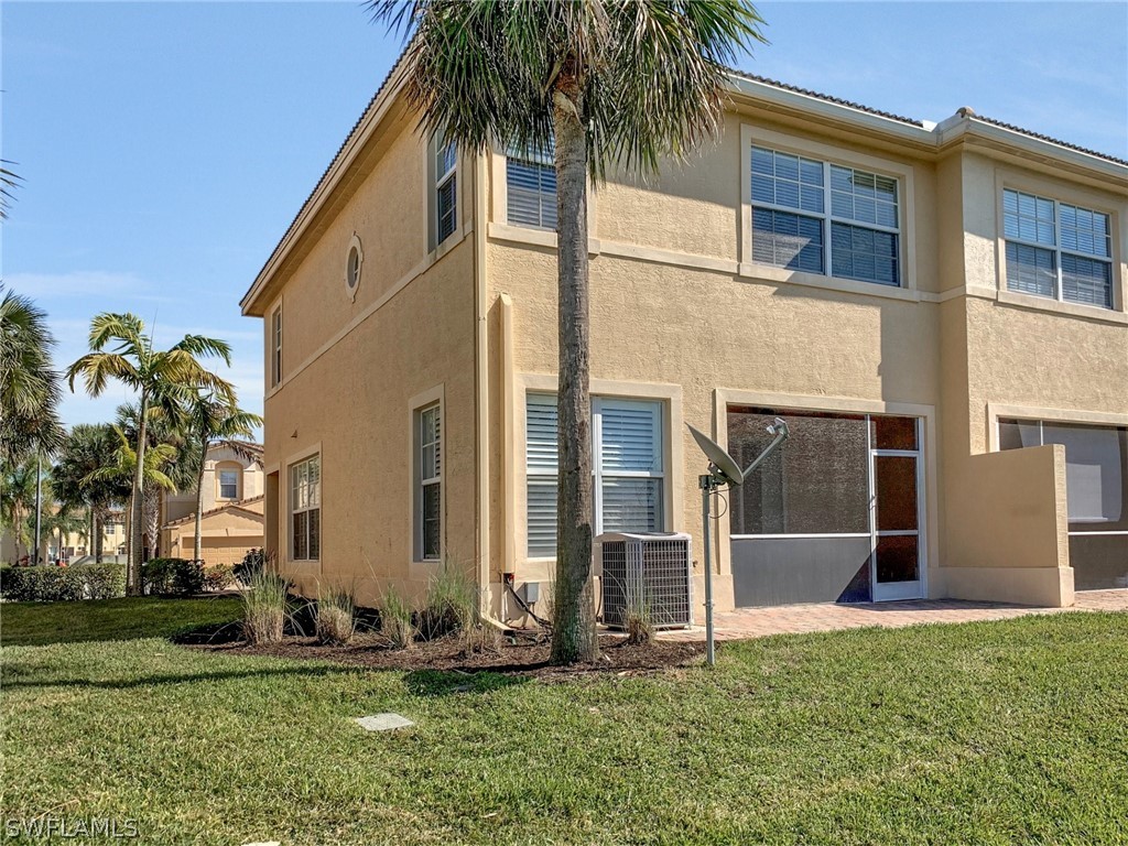 4100 Cherrybrook Loop Fort Myers, FL 33966 - Photo 25 of 25 a backyard of a house with plants and large tree