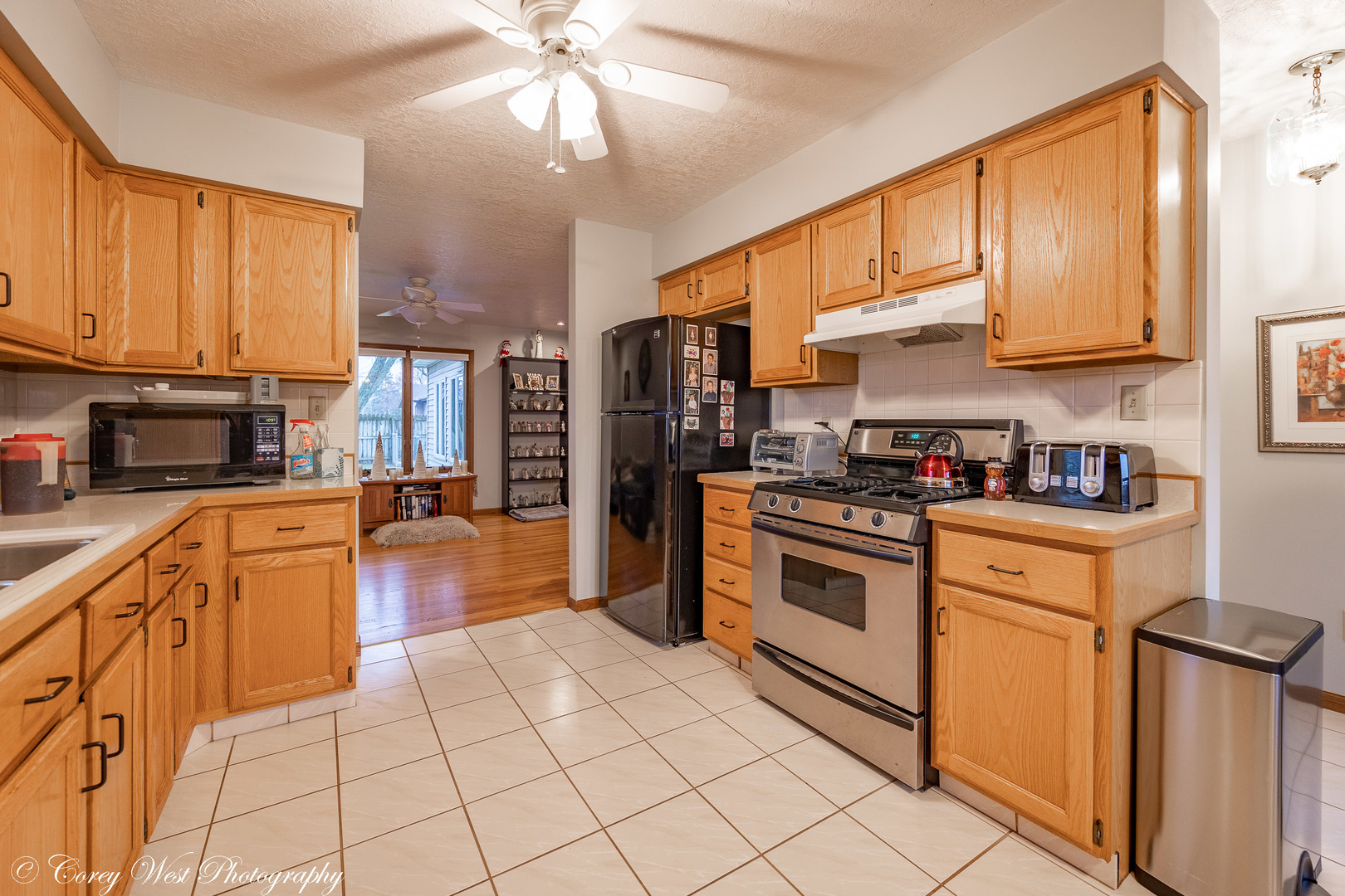 1008 Sunset Terrace Rochelle, IL 61068 - Photo 6 of 30 a kitchen with stainless steel appliances granite countertop a stove a sink and a refrigerator