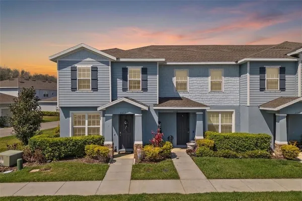 a front view of a house with lots of garden