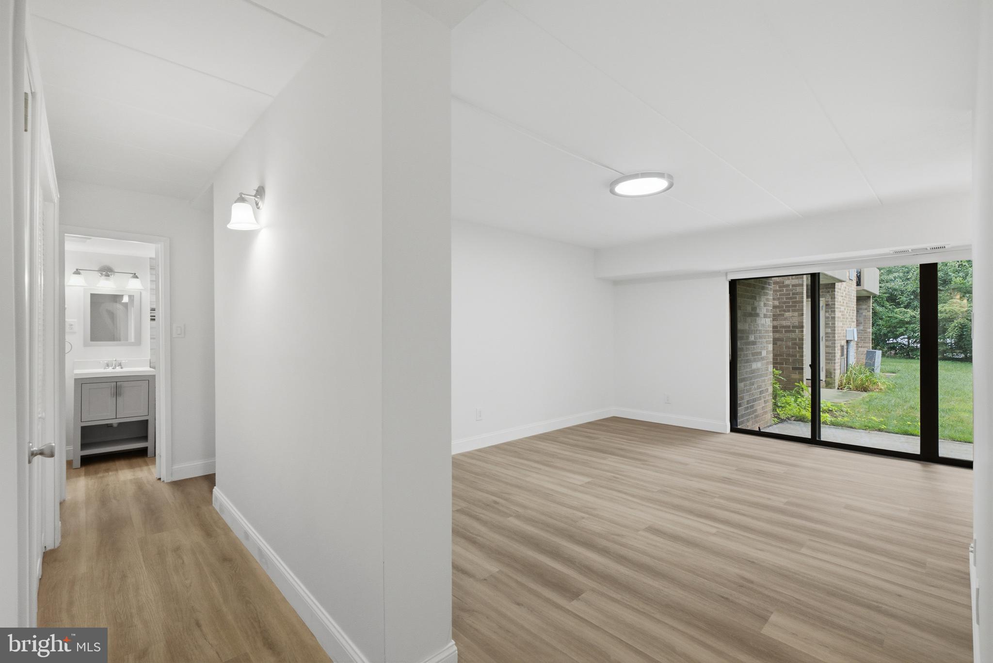 2316 Freetown Court, Unit 10/1B Reston, VA 20191 - Photo 11 of 36 Living Area & Hallway to Bedrooms