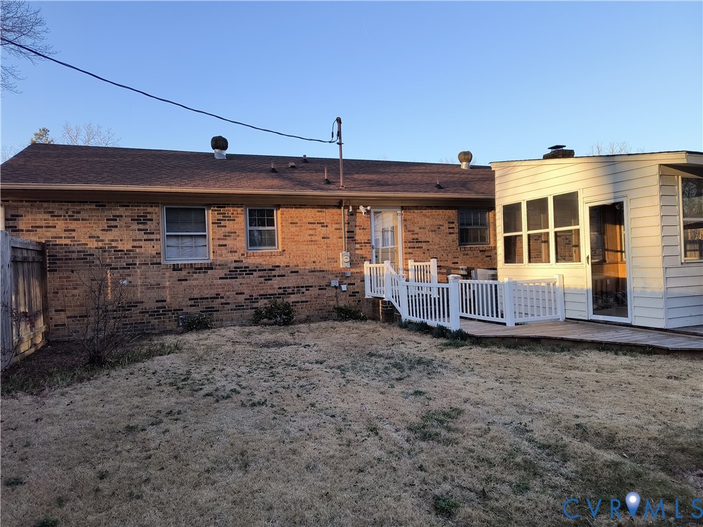 9913 Graves Road Petersburg, VA 23803 - Photo 18 of 24 a view of a house with a small yard and wooden fence