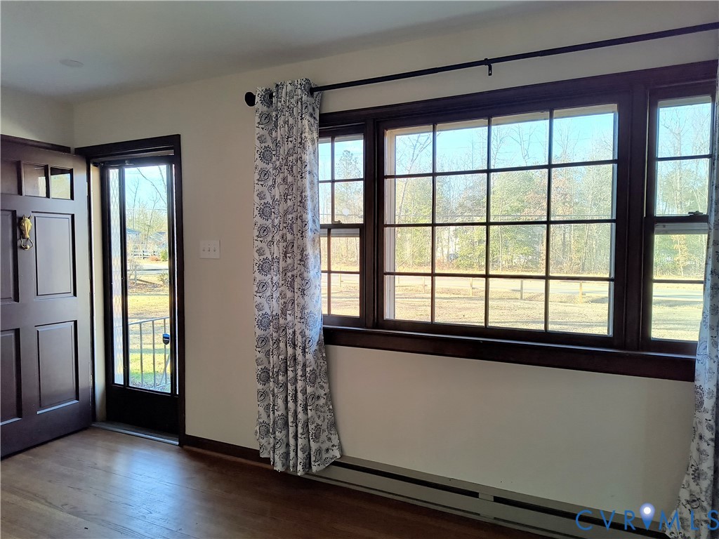 9913 Graves Road Petersburg, VA 23803 - Photo 4 of 24 a view of empty room with wooden floor and fan