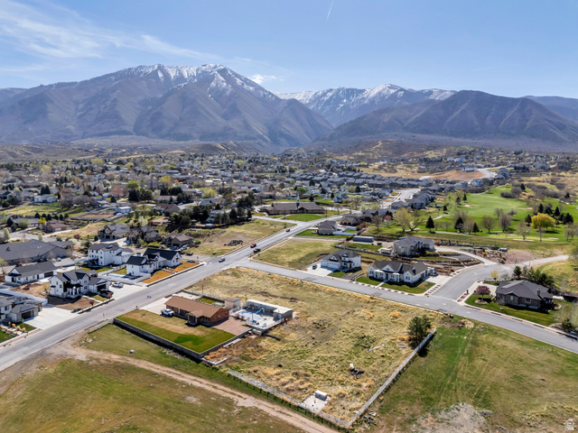 296 West Olympic Lane, Unit 2 Elk Ridge, UT 84651 - Photo 7 of 14 Aerial view of residential area featuring a mountain backdrop