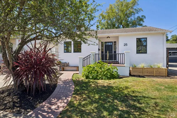 a front view of a house with garden