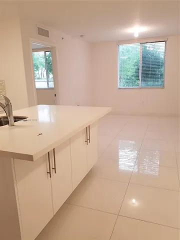 a bathroom with a sink a vanity and a mirror