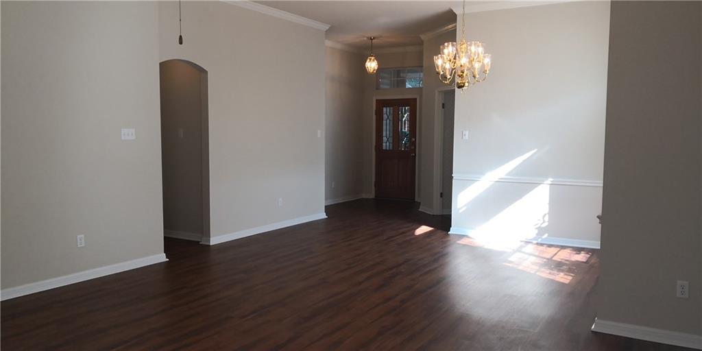 12006 Hispania Court Austin, TX 78727 - Photo 5 of 13 a view of a room with wooden floor and staircase