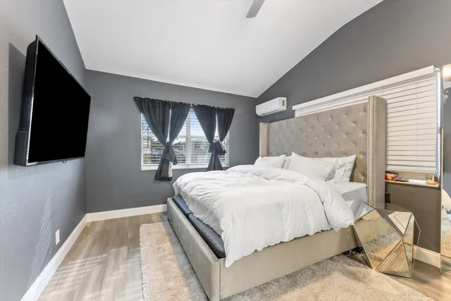 a large white bed in a white room