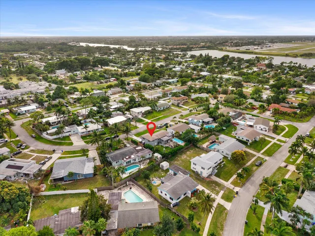 an aerial view of residential houses with outdoor space