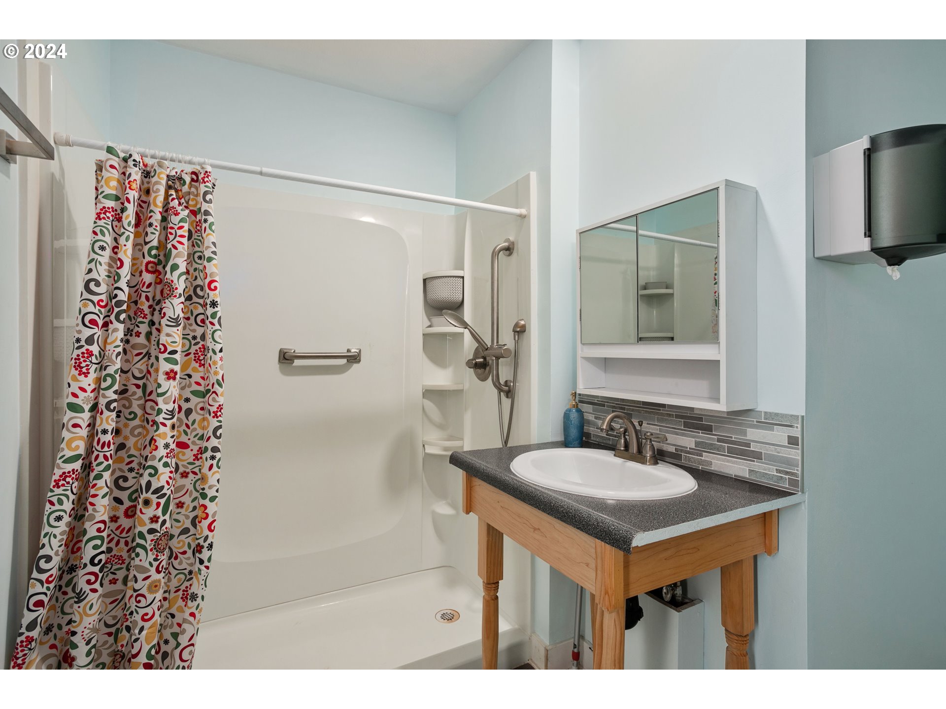 15525 Northeast Caples Road Brush Prairie, WA 98606 - Photo 17 of 40 a bathroom with a sink and a mirror