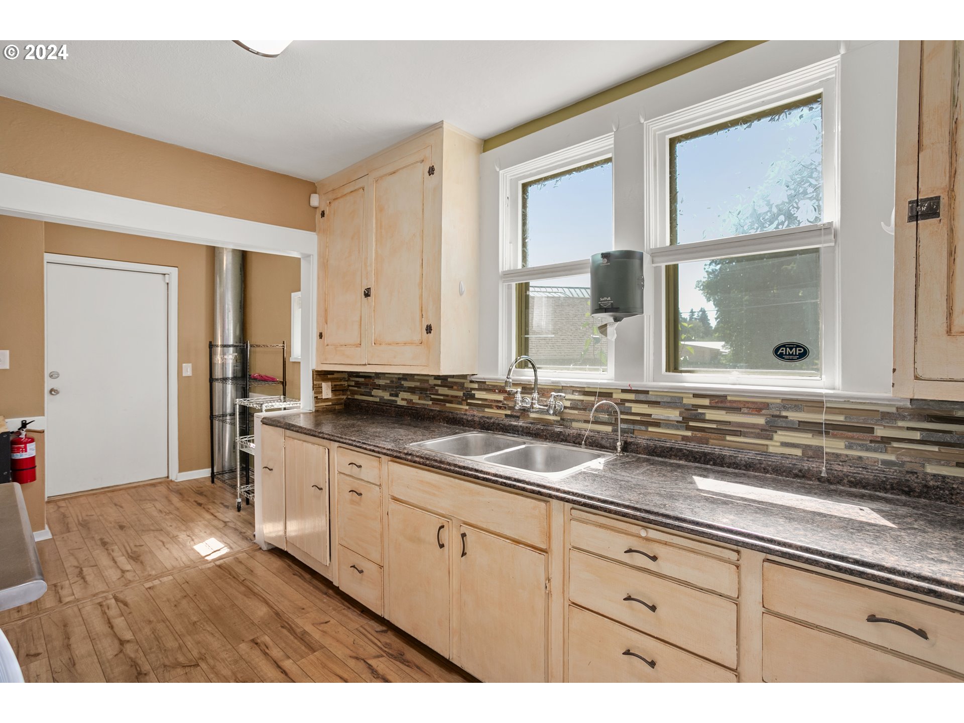 15525 Northeast Caples Road Brush Prairie, WA 98606 - Photo 19 of 40 a bathroom with a granite countertop sink and a mirror