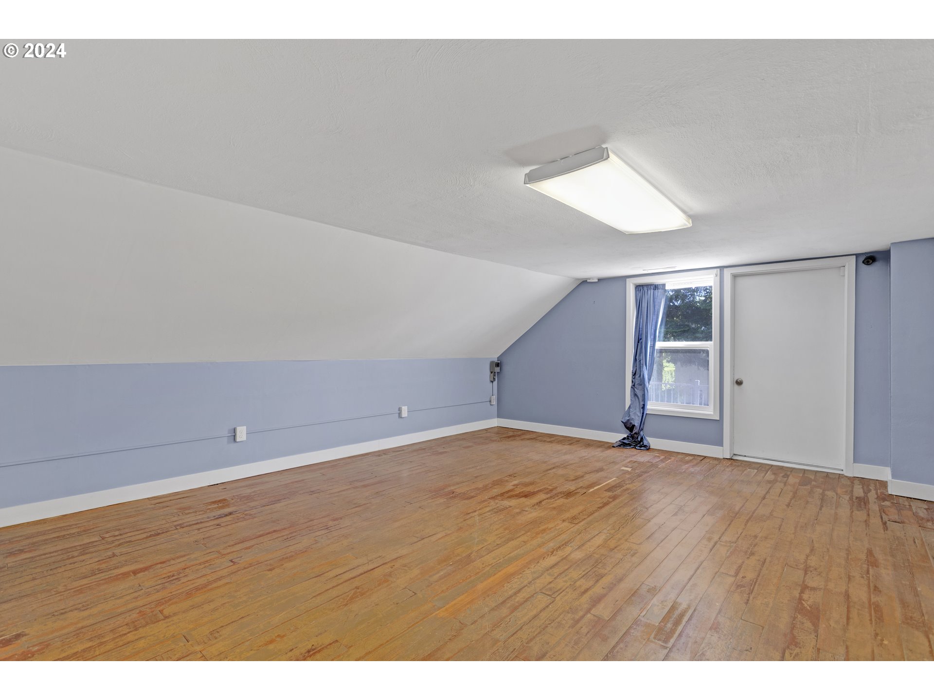 15525 Northeast Caples Road Brush Prairie, WA 98606 - Photo 25 of 40 a view of an empty room with wooden floor